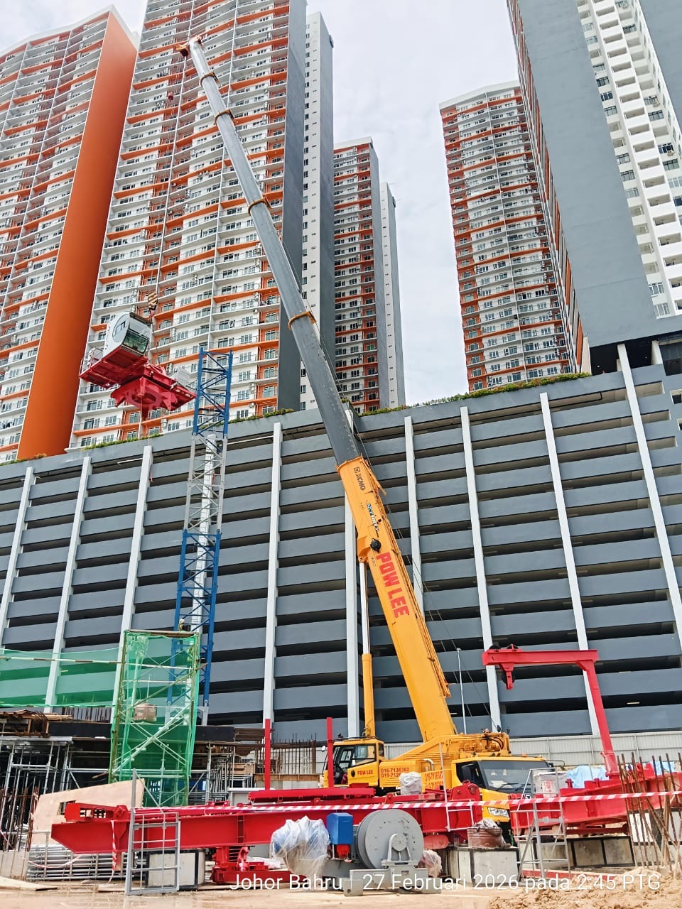 Pow Lee mobile crane supporting tower crane installation in Johor Bahru